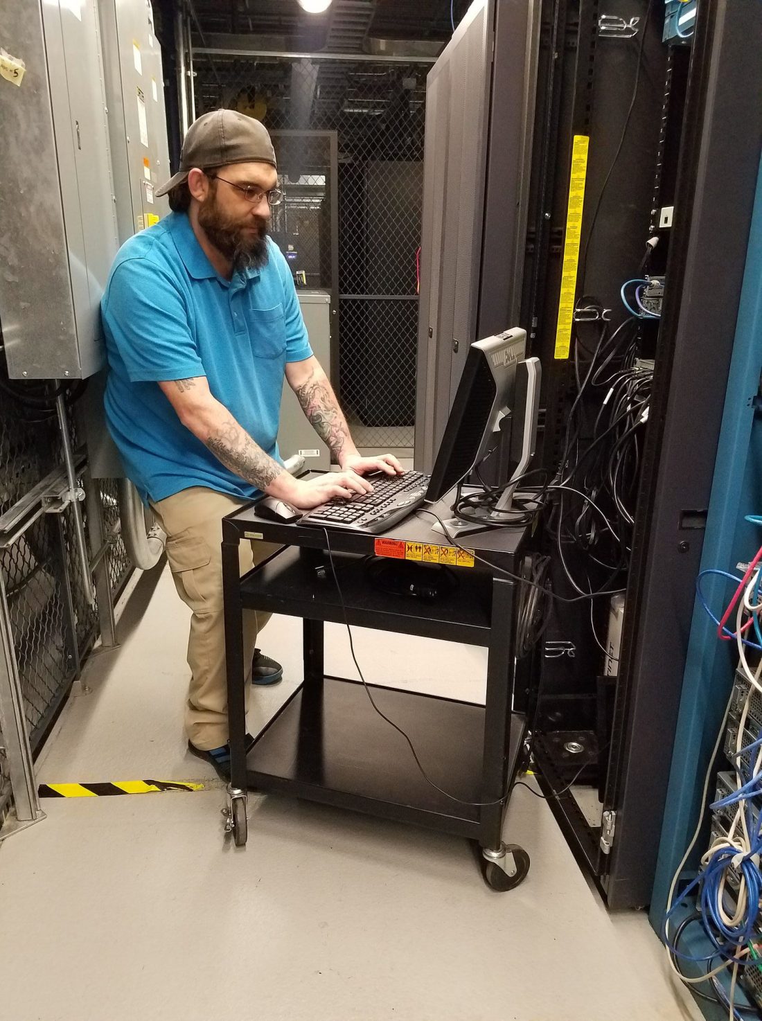 Michael Ward working hands-on in a data center